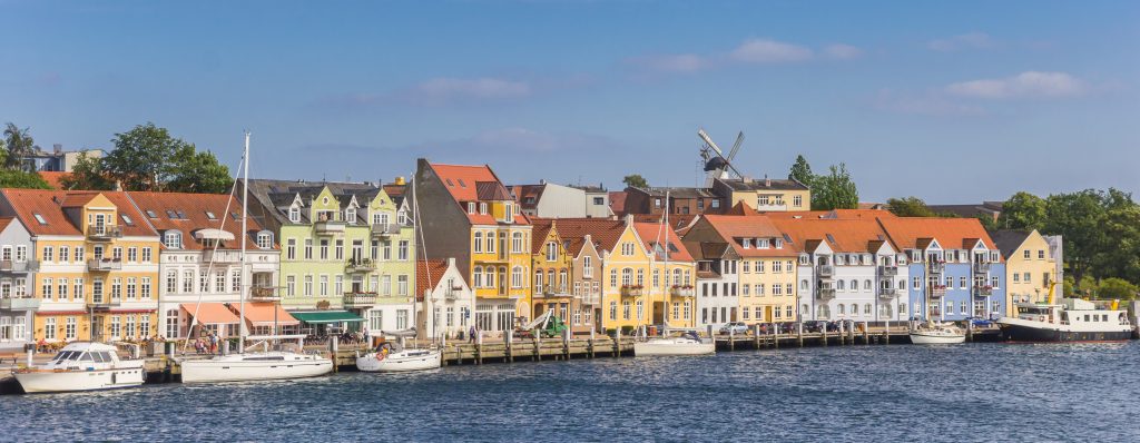 Panorama of colorful old houses at the water in Sonderborg, Denmark