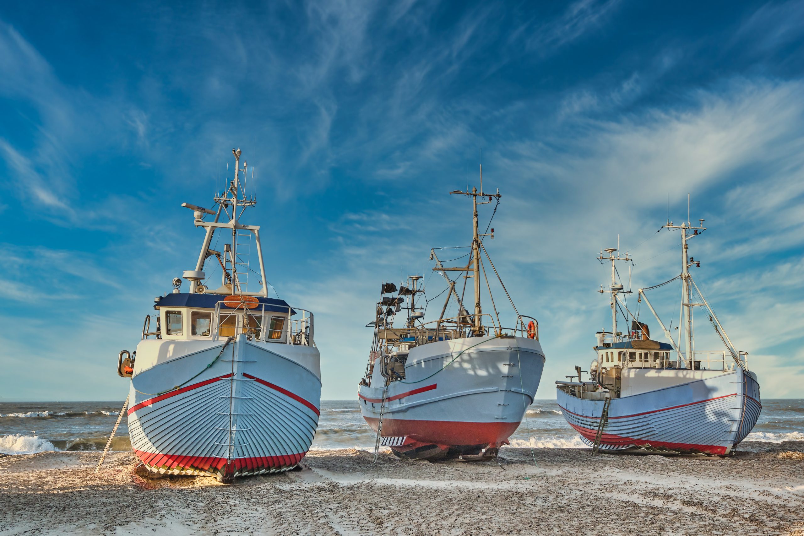 Coastal fishing boats vessels at Thorup beach in Western Denmark
